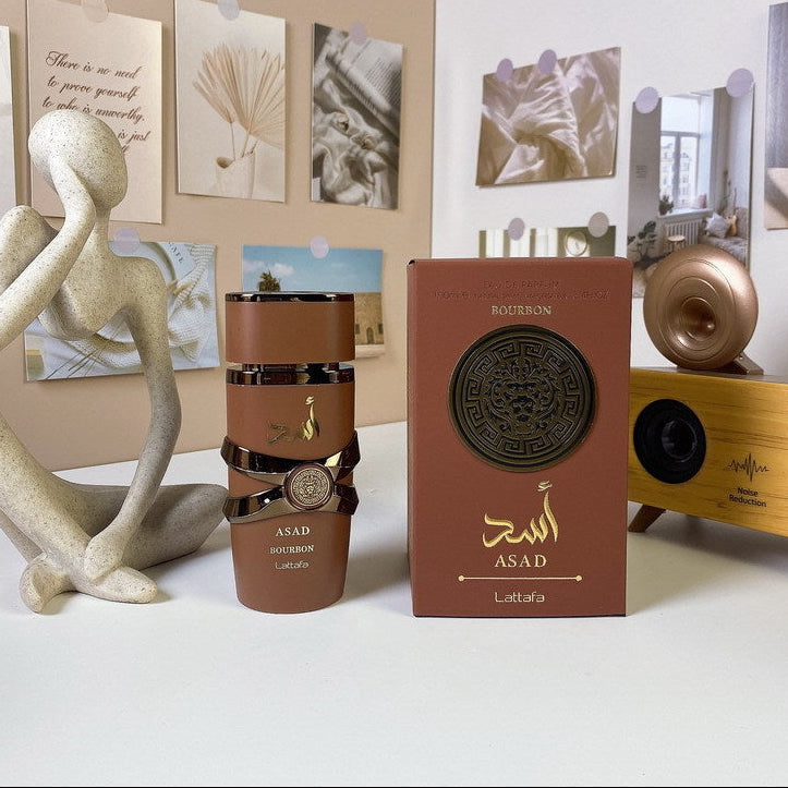 Bourbon bottle and box with decorative elements on a table